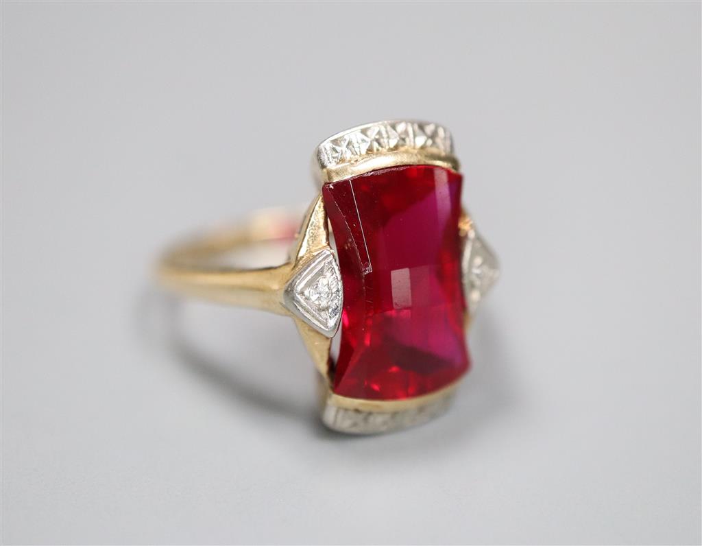 A 1950s? 10k yellow metal and fancy cut synthetic? ruby and diamond chip set dress ring, size L/M, gross 3.5 grams.